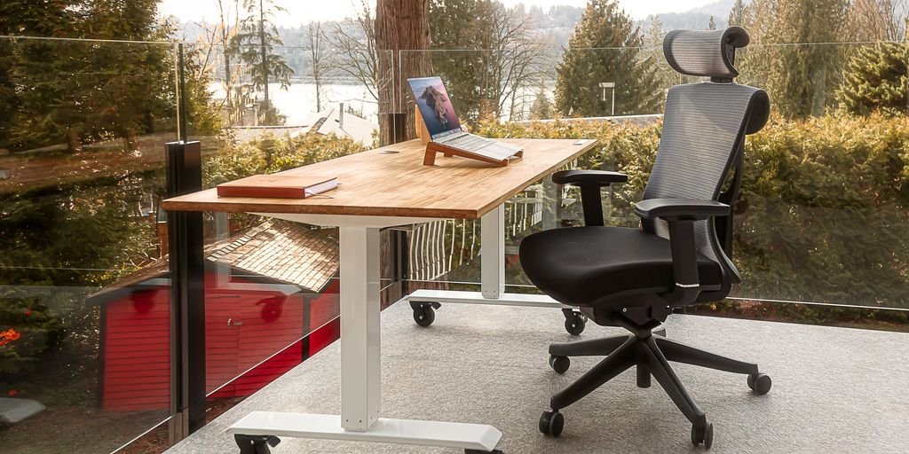 a desk with a laptop on top of it