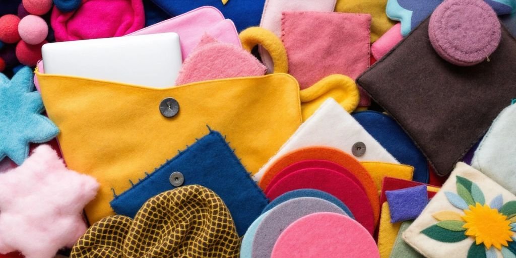 Colourful felt items including laptop sleeves and decor.